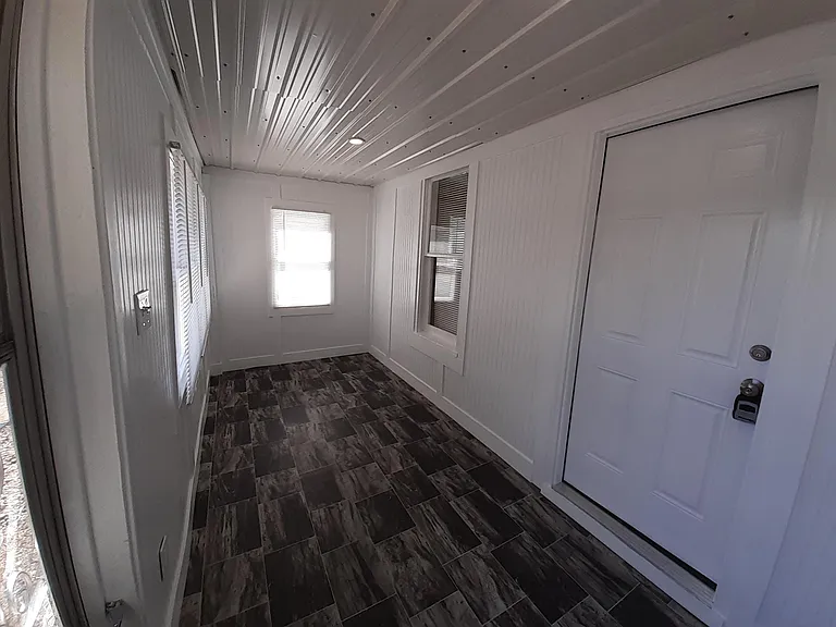 Bright enclosed Sunporch/Mudroom.