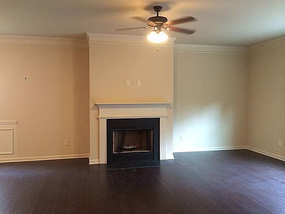 Beautiful dark hardwood floor wide plank with fireplace in f