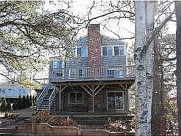 3 levels overlooking pond with direct access