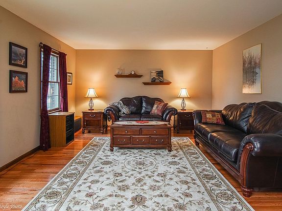 Formal living room with hardwood floors.