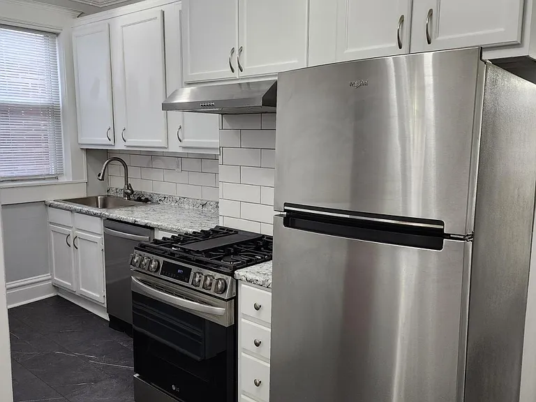 Newly renovated kitchen with stainless steel appliances including dishwasher
