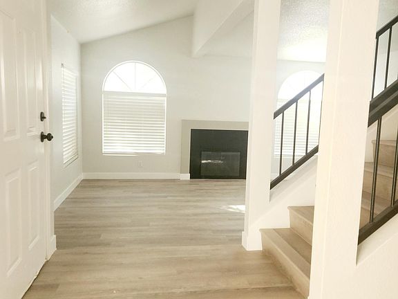 Front foyer on main level with living room to the left, and dining area to the right.