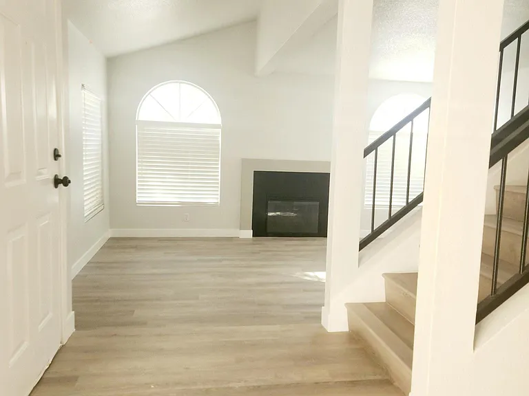 Front foyer on main level with living room to the left, and dining area to the right.