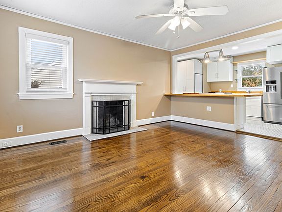 Sparkling Hardwoods in the open concept living room at 907 W Wendover Ave Greensboro NC 27408 Prominently located for small home based business