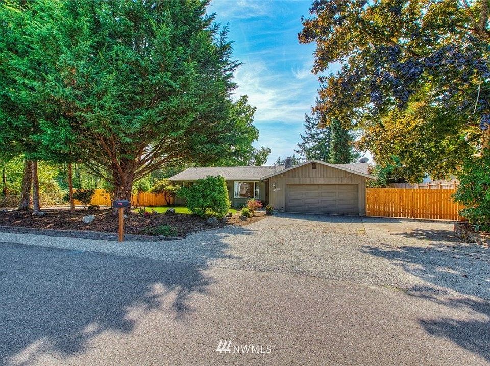 Street View of home showing new landscaping with new front fence and gates.