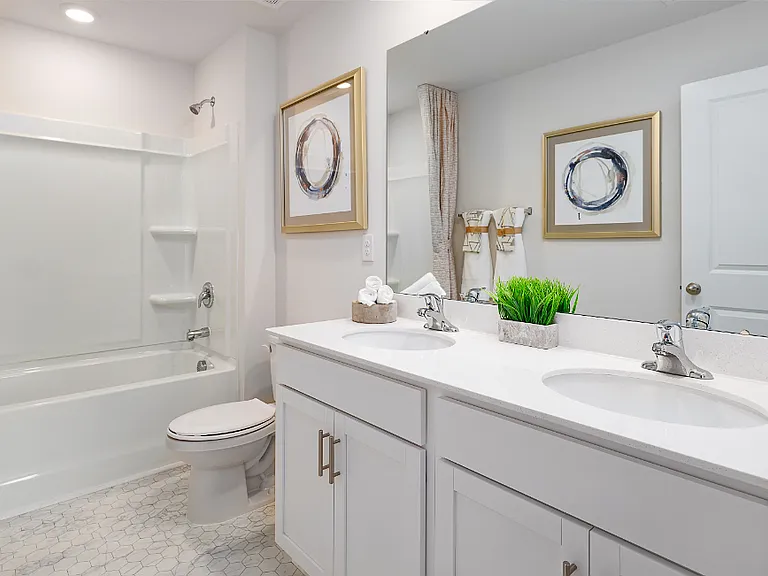 Upper Shared Bath. Photos are builder provided and do not reflect current furnishings or finishes.