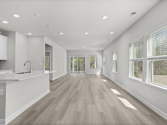 The open-concept living space is accentuated with plenty of natural light.