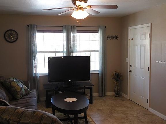 Living room area with nice tile flooring.