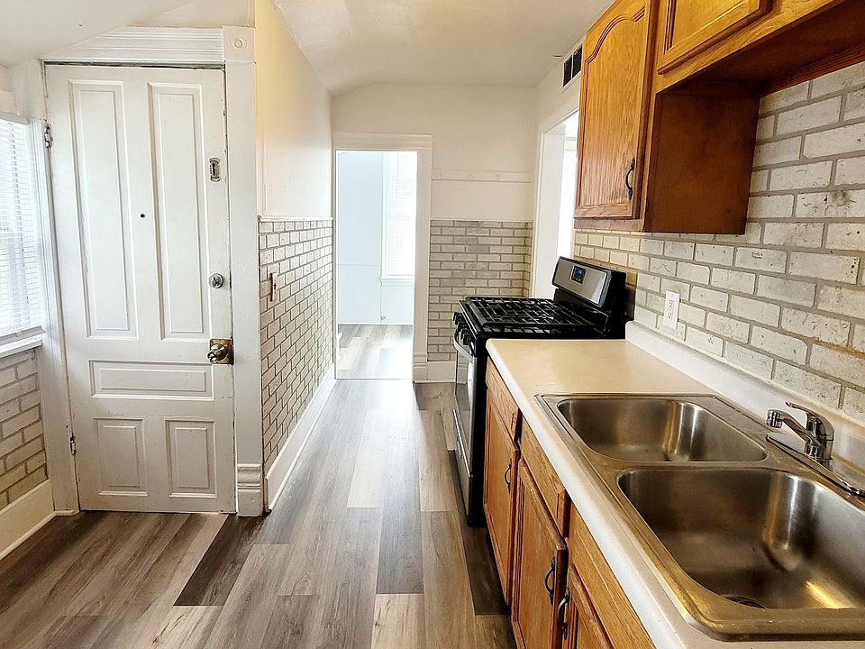 Kitchen with access to walk in storage room/office space