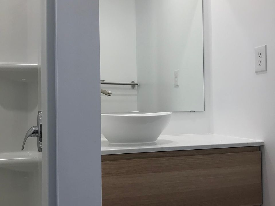 modern vessel sink with European cabinetry