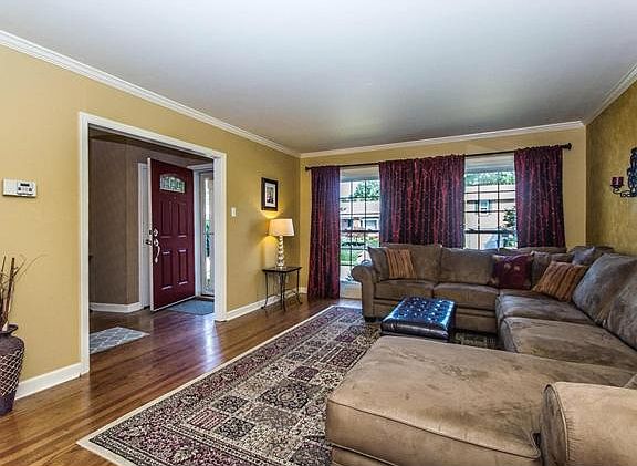 Large living room with floor-to-ceiling windows