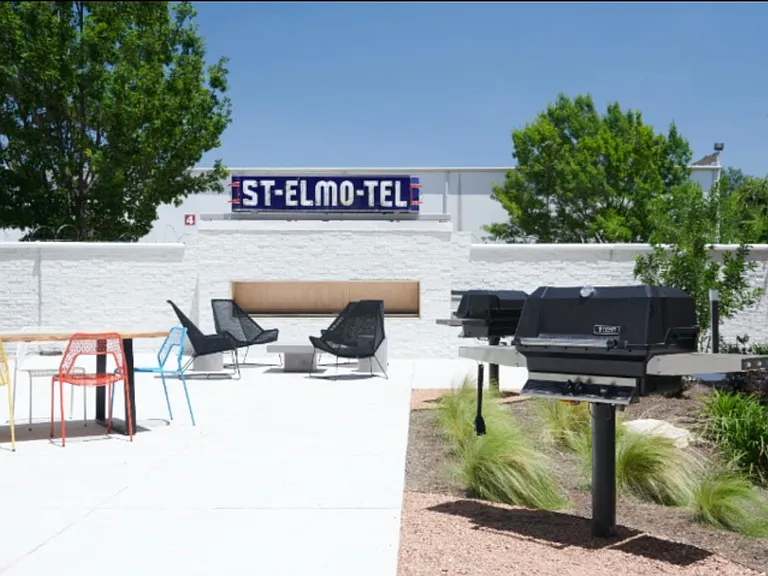Courtyard. Tables, gas Fireplace, 2 grills. This low rise complex has 7 floors and 3 buildings.