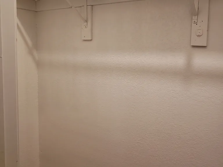 Lighted walk in closet in bigger bedroom