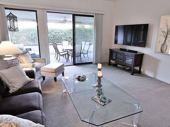 The living room opens up to the patio, creating a beautiful and free flowing space for entertaining guests.