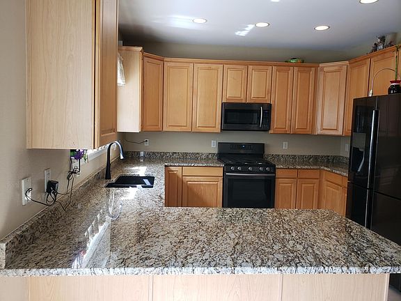 Kitchen with granite countertops and undermount sink