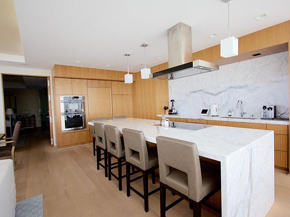 Kitchen offers an island large enough for entertaining