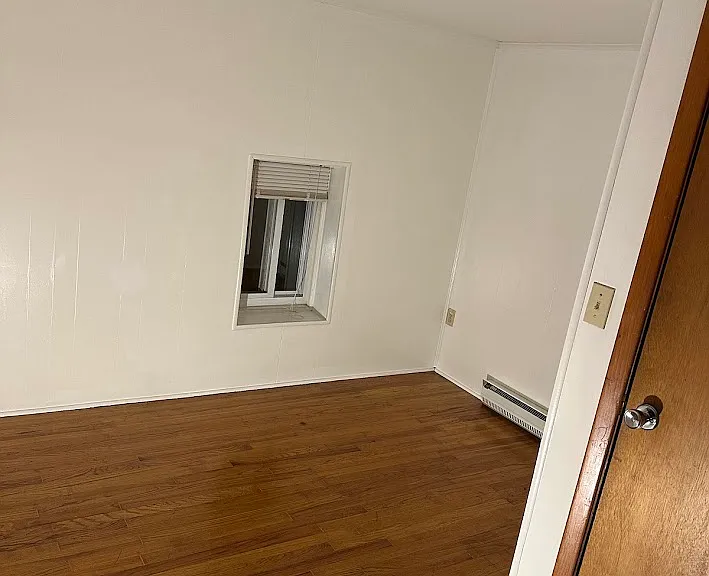 Smaller bedroom, L-shaped, great for office/den. Also has large closet full length of wall (not shown).