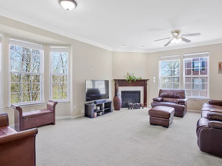 Natural light fills the living room while the fireplace creates the perfect focal point _ warm, inviting, and made for cozy evenings at home.