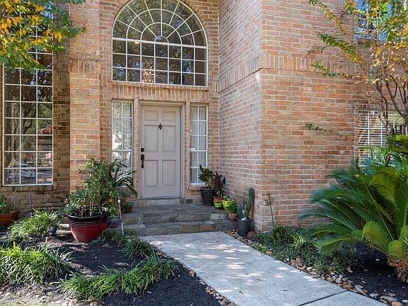 Generous covered front porch with slate tile. Notice the surveillance cameras along the exterior of home ~they stay with the home!