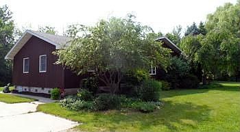 Just another day in Paradise...Nearly 10 acres surround this updated 4 bedroom, 2 bath Country Charmer. The extra large eat-in kitchen features plenty of cupboard and counter space, and an island with extra storage. In addition to the generously sized bedrooms, the living room, family room, and den provide enough space for you to spread out and enjoy the good life. The large outbuilding has heat, electricity, concrete floors and a fenced area for animals. Finally, add to all of these wonderful amenities a pole barn, many areas for a garden, and beautiful landscaping? this property is simply a paradise!