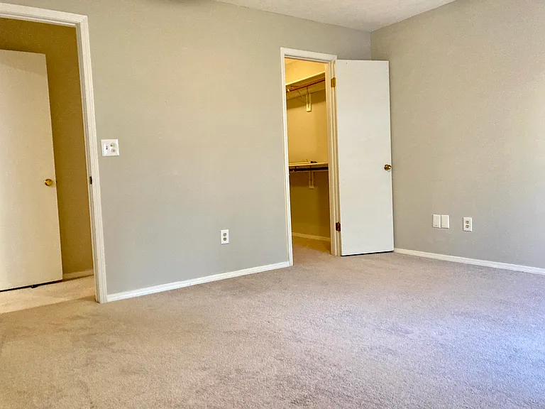 ensuite master bedroom with walk in closet, private door and private access to master bathroom