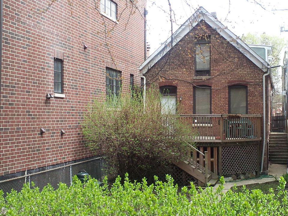Large front yard, Access apartment by side stairs. 3 apartments at this property. Unit is in the rear.