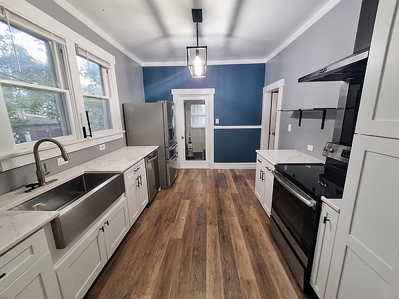 Kitchen with granite counter tops and stainless steel appliances