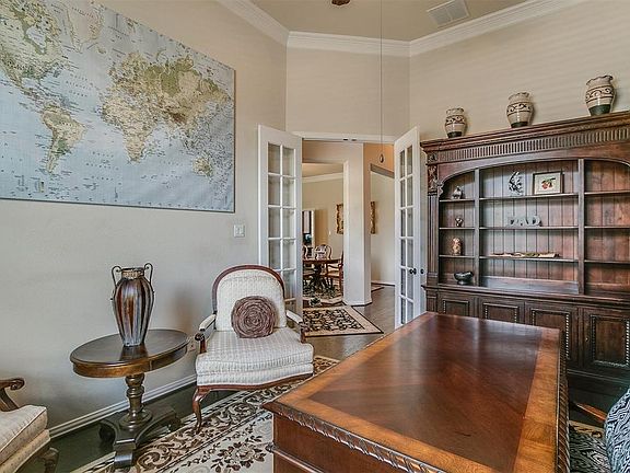 Another view of the study looking through its double French doors through the main entry and in to the formal dining room.