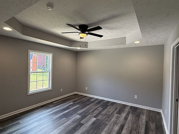 Large master bedroom with ensuite plus tray ceiling and large walk in closet