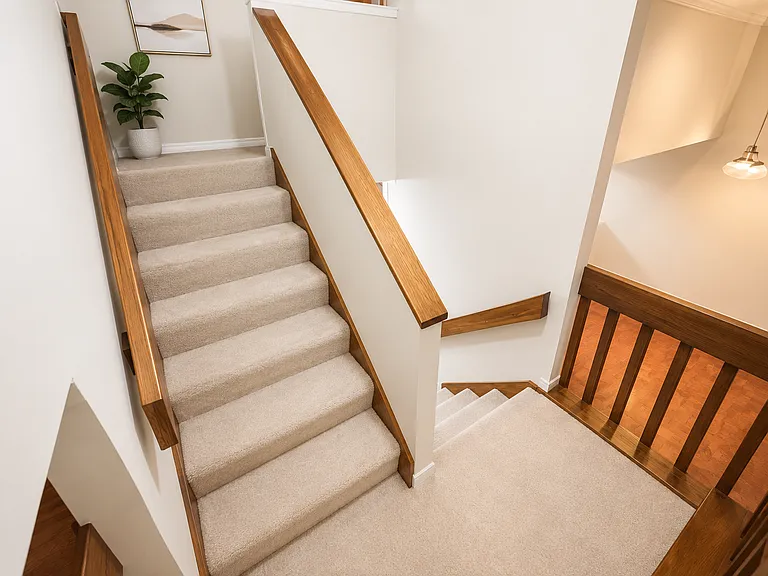 Staircase _ 
Thoughtfully positioned at the center of the home, the staircase offers effortless access to all living spaces.