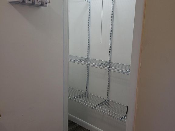 Large well lit pantry, can also serve as extra closet.