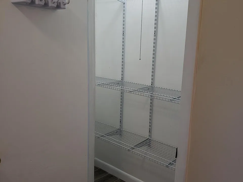Large well lit pantry, can also serve as extra closet.