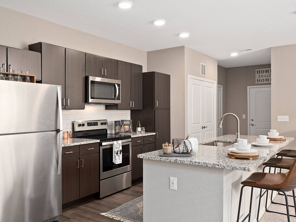 Kitchen with stainless steel appliance and island