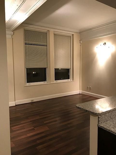 this photo is of a "like" unit. The available unit does not have the historic architecture near the ceiling, as depicted here. All other features are the same.