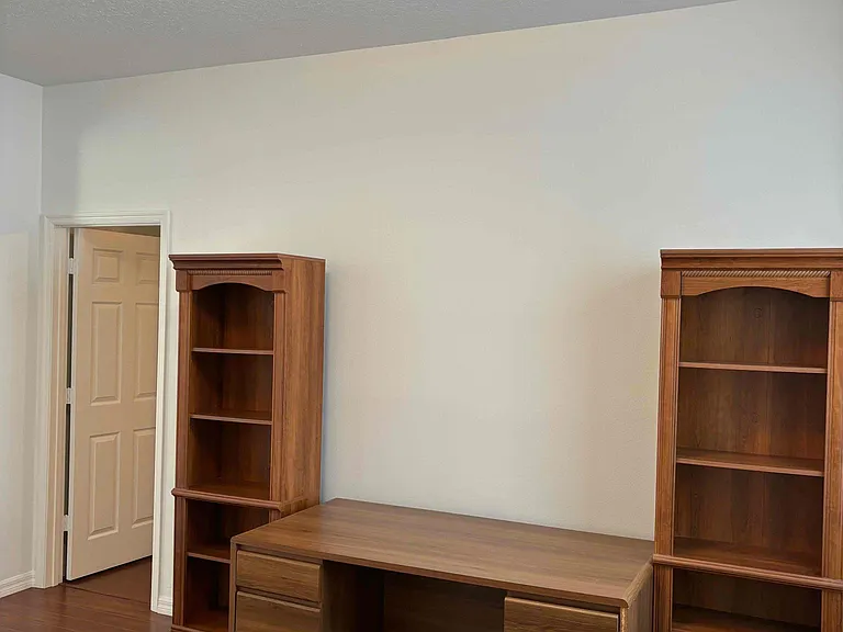 Den / office / playroom area with a view of entrance door to bedroom #2