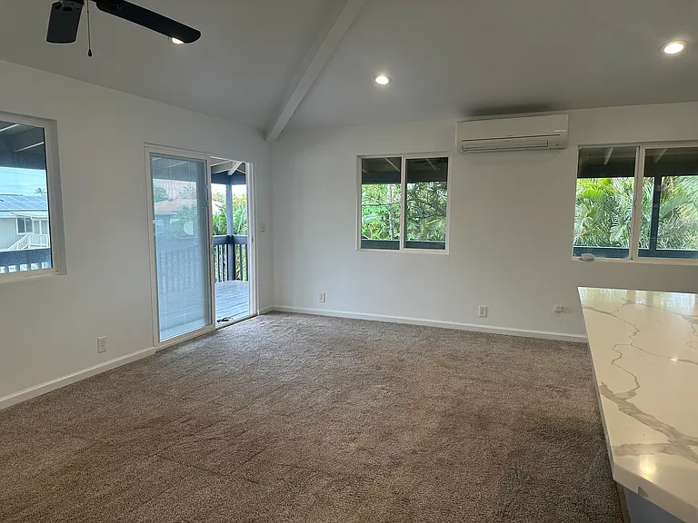 Living area with lots of windows and ventilation