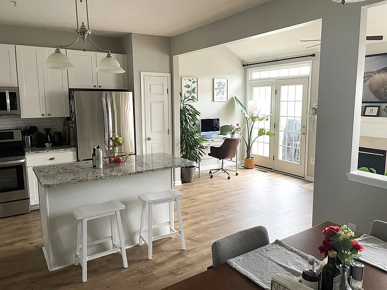 Kitchen and sun room. Door leads to deck.