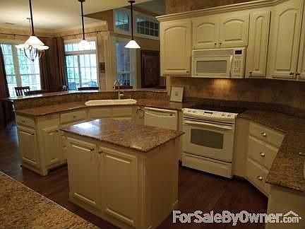 Dining Room Has Wonderful Windows
						:
						The high ceiling and large window create a terrific atmosphere for entertaining