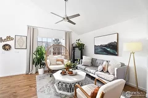 Spacious front living area connected to dining room. Vaulted ceilings and lots of natural light.