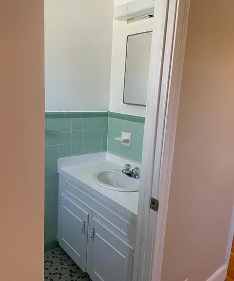 Half bath with plenty of storage.