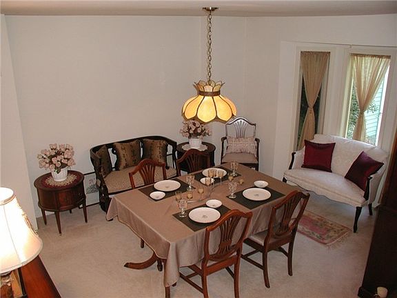 Big Formal Dining Room With Bay Windows