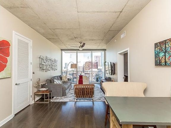 Spacious living/dining/kitchen combo with brand new hardwoods & custom lighting throughout the home.