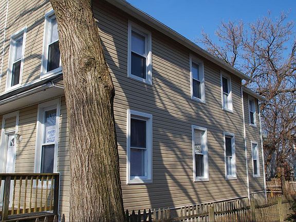 Fenced in yard w/ new siding