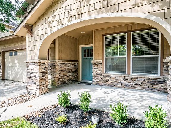 Your covered front porch has views of the mature landscaping.
