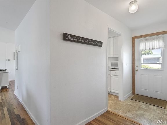 Every space is sunny and bright just like this entry. A window in the front door adds to the welcoming feel!