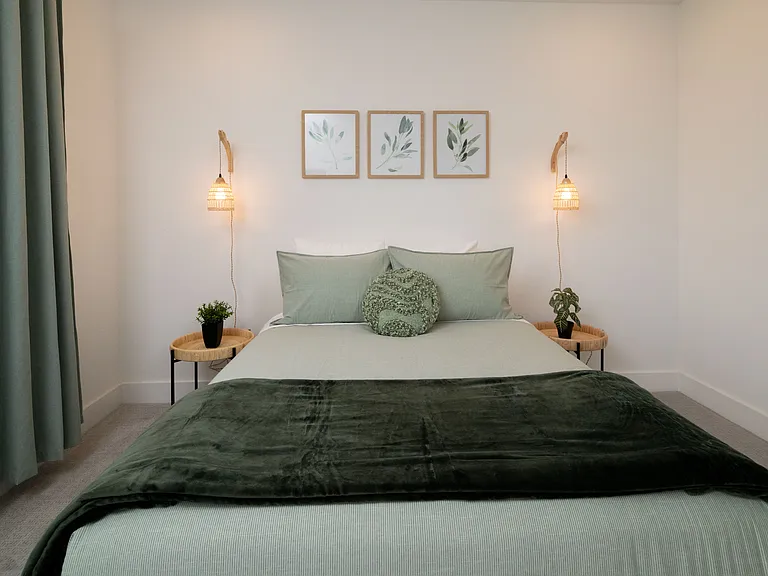 Bedroom #2 has a queen bed with extra pillows and blankets available