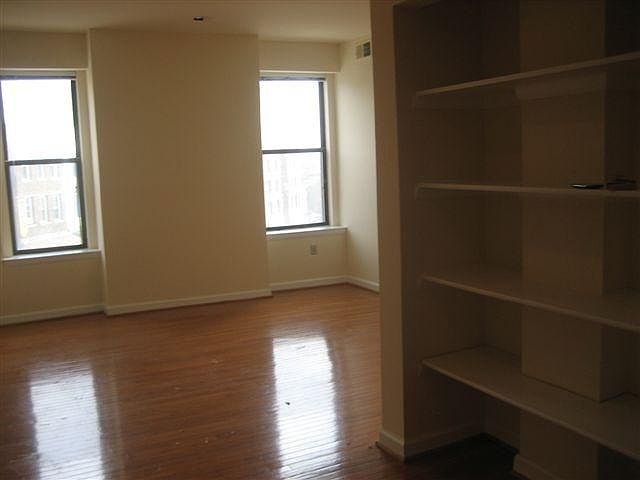 living area with built in bookcase