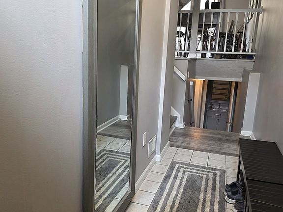 Bright entryway with vaulted ceiling.