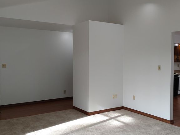 Living Room: Viewing Front Entry, Back of Coat Closet, & Kit