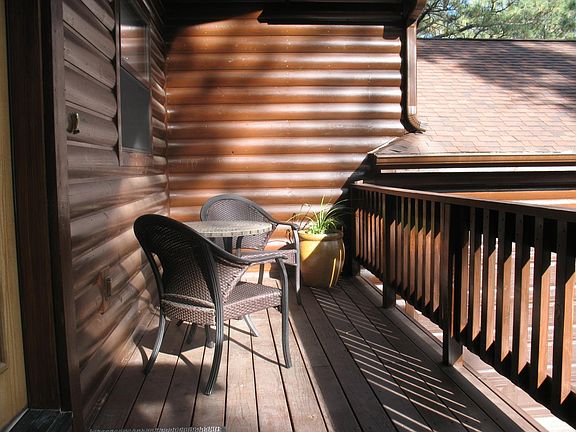 Front deck with bistro table and seating for two.